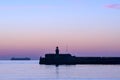 Spectacular early morning view of East Pier lighthouse of famous Dun Laoghaire harbor during the blue hour before sunrise, Dublin