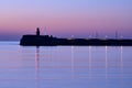 Spectacular early morning view of East Pier lighthouse of famous Dun Laoghaire harbor during the blue hour before sunrise, Dublin