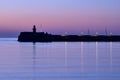 Spectacular early morning view of East Pier lighthouse of famous Dun Laoghaire harbor during the blue hour before sunrise, Dublin