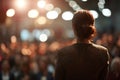 Spectacular female politician speaks on stage in front of crowds