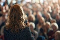 Spectacular female politician speaks on stage in front of crowds