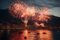 A spectacular fireworks display by the seaside reflecting in the water