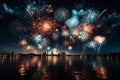 A spectacular fireworks display by the seaside reflecting in the water