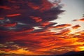 Cirrus clouds in spectacular golden orange sunset. Royalty Free Stock Photo