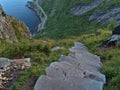 Spectacular high angle view of steep rock stairs built by Nepali Sherpas leading to the top of mountain Reinebringen.