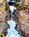 The spectacular ice and snow cone in winter at the bottom of Spahats Falls on Spahats Creek in Wells Gray Provincial Park Royalty Free Stock Photo