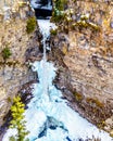 The spectacular ice and snow cone in winter at the bottom of Spahats Falls on Spahats Creek in Wells Gray Provincial Park Royalty Free Stock Photo