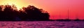 Crimson Colored Coastal Sunrise Seascape With Boats.