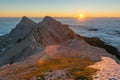 Spectacular morning mountain panorama with sun raising above sea of clouds. Royalty Free Stock Photo