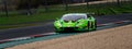 Spectacular motorsport scenic view of supercar touring Lamborghini Huracan racing car in action out of curve on kerbs Royalty Free Stock Photo