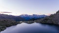 Spectacular mountain masif at sunrise rising above glacier lake. Royalty Free Stock Photo