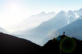 Spectacular mountain ranges silhouettes. Man reaching summit enjoying freedom. View from Top of Mount Corno di Tres Royalty Free Stock Photo