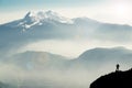 Spectacular mountain ranges silhouettes. Man reaching summit enjoying freedom. View from Top of Mount Corno di Tres Royalty Free Stock Photo