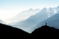 Spectacular mountain ranges silhouettes. Man reaching summit enjoying freedom. View from Top of Mount Corno di Tres Royalty Free Stock Photo