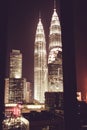 Spectacular night city view from window. Kuala Lumpur famous skyscrapers. Business metropolis. Modern buildings. Luxurious travel