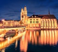 Spectacular night cityscape of Zurich city, Switzerland, Europe. Picturesque evening view of Grossmunste - Protestant church refle Royalty Free Stock Photo