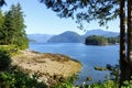 Spectacular ocean seascape of a beautiful blue ocean surrounded by islands covered in forest along the sunshine coast