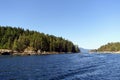 Spectacular ocean seascape of a beautiful blue ocean surrounded by islands covered in forest along the sunshine coast