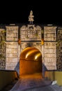 Ornamented gate city entrance of old military fort at night in Elvas, Portugal