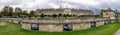 A spectacular panoramic view of the Army Museum at Les Invalides complex with historic cannons and landscaped garden, Paris Royalty Free Stock Photo