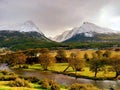 Spectacular panoramic view of the landscape of Tierra del Fuego National Park. Snowy mountains and exuberant vegetation. Climate