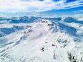 Spectacular panoramic view over snowcapped mountain peaks.