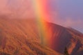 Spectacular rainbowainbow, island style, over the west Maui mountains at sunset Royalty Free Stock Photo