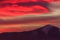 A spectacular red cloud above the mountains Royalty Free Stock Photo