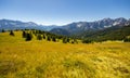 Craggy peaks of Italian Dolomites framed by greenery of meadows and forests Royalty Free Stock Photo