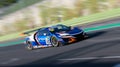 Spectacular scenic racing car on asphalt racetrack Honda NSX blurred motion background