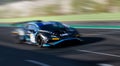 Spectacular scenic racing car on asphalt racetrack Lamborghini Huracan blurred motion background