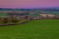 A spectacular show of colors during the sunrise in the rolling hills of the Netherlands over the village of Epen, in the Heuvellan Royalty Free Stock Photo