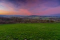 A spectacular show of colors during the sunrise in the rolling hills of the Netherlands over the village of Epen, in the Heuvellan Royalty Free Stock Photo