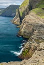 Spectacular steep coastline with high cliffs of faroe islands