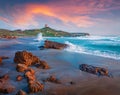 Spectacular summer sunset on Sardinia, Italy, Europe. Perfect evening view of Capo San Marco Lighthouse on Del Sinis peninsula. Co Royalty Free Stock Photo