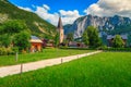 Wonderful green fields and alpine village with church, Altaussee, Austria Royalty Free Stock Photo