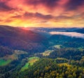 Spectacular sunrise on Carpathian mountains. Fog spreads on the valley of Snidavka village, Ukraine, Europe. Royalty Free Stock Photo