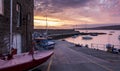 Spectacular sunrise over New Quay harbor, on the Welsh coastline