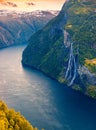 Spectacular sunrise scene of Sunnylvsfjorden fjord, Geiranger village location, western Norway. Aerial view of famous Seven Royalty Free Stock Photo