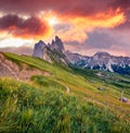 Spectacular sunset on Funes Valley. Stuninng summer view of Furchetta peak. Amazing evening scene of Puez Odle National Park, Dolo Royalty Free Stock Photo
