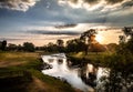 Spectacular sunset landscape with starburst of the surrounding area near Brougham Castle in Cumbria, England Royalty Free Stock Photo