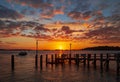 Spectacular sunset over a jetty at Sandbanks Ferry, Poole Harbour