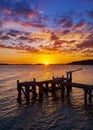 Spectacular sunset over a jetty at Sandbanks Ferry, Poole Harbour