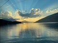 Spectacular sunset over Lake Thun, Switzerland with rolling hills in the background Royalty Free Stock Photo