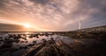 A spectacular sunset at the Slankop lighthouse at Kommetjie in Cape Town, Western Cape of South Africa. Royalty Free Stock Photo