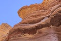 Spectacular surfaces of the stone mountains in the Red Slot Canyon. Travel Royalty Free Stock Photo