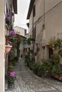 Spectacular traditional italian medieval alley in the historic center of beautiful little town of Spello Perugia Royalty Free Stock Photo