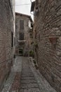 Spectacular traditional italian medieval alley in the historic center of beautiful little town of Spello Royalty Free Stock Photo