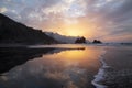 Spectacular twilight reflecting in the calm waves washing the wild Benijo beach or Playa de Benijo, Tenerife, Canary Islands