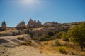 Spectacular unique volcanic rock formations at love valley. Beautiful landscape with mountains in summer in Sunny weather.